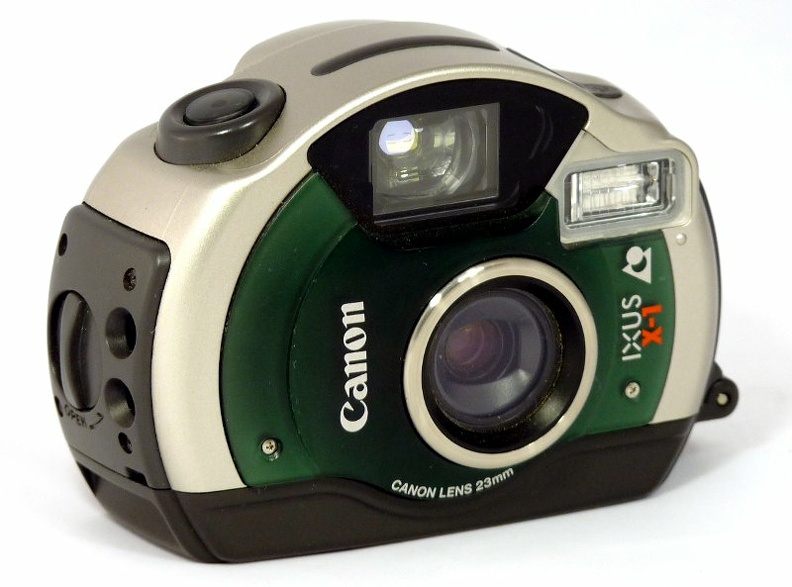 Nom : Ixus X-1
Marque : CANONFabricant : Canon Inc.
Publicité : XXX
Pays : XXX
Date de début : 0Date de fin : 0
Type : compact APS (CFF+)
Dimensions, fermé : XXXOuvert : XXX
Poids : XXX
Matière : XXXCouleur : XXX
Surf. sensible : IX240Format : C, H, P
Objectif :
- Nom : XXXType : XXX
- Marque : XXX
- Ouverture : XXXFocale : XXX
- Fixation : XXXMonture : XXX
Diaphragme :
- Type : XXX
- Ouverture : XXX
Obturateur :
- Nom : XXXType : XXX
- Marque : XXX
- Vitesses : XXXPose : XXX
- Retardateur : XXX
- Armement : XXX
Film, plaque :
- Compte-vues 1 : XXXCompte-vues 2 : XXX
- Protection 2 expos : XXX
- Avancement : XXX
Flash :
- Synchro : XXX
- Flash interne : XXX
Posemètre :
- Type : XXX
- Plage : XXX
- Automatisme : XXX
Mise au point :
- Type : XXXMinimum : XXX
- Télémètre : XXX
Viseurs :
- Viseur 1 : XXX
- Viseur 2 : XXX
- Viseur 3 : XXX
Autres :
Niveau à bulle : XXX
Porte-acc. 1 : XXXPorte-acc. 2 : -
Écrou de pied : XXX
Déc. vertical : XXXHorizontal : XXX
Bascule avant : XXXArrière : XXX
Commentaires : -
Liens web :-
Appareil présenté :
N° de série : XXX
N° objectif : XXXN° obturateur : XXX
Accessoires : -
Notice : XXX
Commentaires : -
N° inventaire : APP2595_01
Ixus X-1 (Canon)
APP2595
-
Nom: Ixus X-1
Marque: CANON; Fabricant: Canon Inc.
Pays: Japon
Date: début: 1999; fin: 2002
Type: compact APS (CFF+)
Réf McKeown 2005-2006: -
Dimensions: 106x74x48mm; poids: 230g
Matière: plastique; couleur: gris, vert
Surface sensible: IX240; format: H, P, C
Objectif: type: ?; fabricant: Canon; ouv./focale: 1:4,8 f=23mm; fixation: fixe
Diaphragme: type: ?; ouvertures: 4,8 - 14
Obturateur: type: ?; fabricant: ?; vitesses: 1/2s - 1/650s; pose: -
Retardateur: 10s; Armement: couplé à l'avance du film
Compte-vues: ACL; Protection 2 expos: oui; Avance du film: moteur électrique
Synchro flash: X; flash intégré: oui
Posemètre: type: silicium; plage: 25-10000 ISO; automatisme: programmé
Mise au point: type: AF; mini: 45cm (90cm à 3m en sous-marin); télémètre: auto-focus actif
Décentrement: -; bascule: -
Viseur: albada collimaté; Porte-accessoire: -
Commentaires:
Il est possible d'incruster une date ou un message.
Le viseur comporte des marques de cadrage en fonction du format choisi.
Pile CR2.
Appareil sous-marin, il peut être utilisé jusqu'à 5m de profondeur.
Aux Etats-Unis, il s'appelle Elph Sport et au Japon IXY D5.
Appareil présenté
N° de série: 4004987
N° objectif: -; N° obturateur: -
Notice: -
Accessoires, sac: -
Commentaires:
APP2595_01.jpg