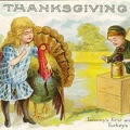 Garçon photographiant une fillette avec un dindon, Thanksgiving<br />(CAP0524)