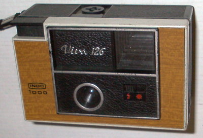 APP0226a
?, f11/40
rotatif, 2 vit.
-
Nom: Viva 126 1000 (2)
Marque: FEX; fabricant: Indo; publicité: -
Pays: France
Date: début: ?1978; fin: 1979
Type: (CFFG)
Dimensions: 120x75x55mm; poids: 200
Matière: plastique; Couleur: noir/bois
Surface sensible: film 126; format: 28x28mm
Objectif: nom: ?; fabricant:?; ouv./focale: f11/40; fixation : fixe
Diaphragme: type: fixe; ouvertures: f11
Obturateur: nom: rotatif; fabricant: ?; vitesses: 2 vit.; pose: -
Retardateur: -; Armement: -
Compte-vues: fenêtre; Protection 2 expos: -
Synchro flash: flash-cube; flash intégré: -
Posemètre: type: -; plage: -; automatisme: manuel
Mise au point: type: fixe; mini: ?; télémètre: -
Décentrement vert.: -; hor.: -; bascule avant: -; arrière: -
Viseur: simple; Porte-accessoire: flash cube; Niveau: -
Mode d'emploi: -
Commentaires:
sérigraphie sur corps
Appareil présenté
N° de série: -
N° objectif: -; N° obturateur: -
Accessoires: -; sac: -
APP0226a.jpg