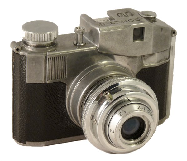 Comet II (Bencini)
APP1012_0a
?, f?/75mm
?, 1/50s
-
Nom: Comet II
Marque: BENCINI; fabricant: ?; publicité: -
Pays: Italie
Date: début: -1951; fin: ??
Type: (CRFK)
Dimensions: 106x74x58;106x74x74mm; poids: 310g
Matière: métal gainé; Couleur: noir/argenté
Surface sensible: film 127; format: 4x4cm
Objectif: nom: ?; fabricant:?; ouv./focale: f?/75mm; fixation : rentrant
Diaphragme: type: fixe; ouvertures: ?
Obturateur: nom: ?; fabricant: ?; vitesses: 1/50s; pose: B
Retardateur: -; Armement: -
Compte-vues: fenêtre (x2); Protection 2 expos: -
Synchro flash: X; flash intégré: -
Posemètre: type: -; plage: -; automatisme: manuel
Mise au point: type: frontale; mini: 1m; télémètre: -
Décentrement vert.: -; hor.: -; bascule avant: -; arrière: -
Viseur: galilée; Porte-accessoire: sabot non synchronisé; Niveau: -
Mode d'emploi: -
Commentaires:
bague des distances chromée, à l'avant
Appareil présenté
N° de série: A1844
N° objectif: -; N° obturateur: -
Accessoires: -; sac: -
APP1012_0a.jpg