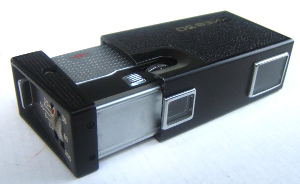 Nom : Kiev 30
Marque : ARSENALFabricant : Arsenal
Publicité : -
Pays : URSS
Date de début : - 1974Date de fin : - 1983
Type : miniature (CFFD)
Dimensions, fermé : 86 x 27 x 45 mmOuvert : 110 x 27 x 45 mm
Poids : 147 g (sans cartouche)
Matière : plastique, aluminiumCouleur : noir, gris
Surf. sensible : film 16mm non perforéFormat : 13 x 17 mm
Objectif :
- Nom : Industar-MType : XXX
- Marque : XXX
- Ouverture : 3,5Focale : 23 mm
- Fixation : fixeMonture : non interchangeable
Diaphragme :
- Type : XXX
- Ouverture : 3,5 à 11
Obturateur :
- Nom : -Type : guillotine
- Marque : -
- Vitesses : 1/30 s - 1/60 s - 1/200 sPose : non
- Retardateur : non
- Armement : couplé à l'avance du film
Film, plaque :
- Compte-vues 1 : compteur xx vues
- Protection 2 expos : oui
- Avancement : téléscopique
Flash :
- Synchro : X
- Flash interne : non
Posemètre :
- Type : sans
- Plage : -
- Automatisme : manuel
Mise au point :
- Type : frontaleMinimum : 50 cm
- Télémètre : non
Viseurs :
- Viseur 1 : simple
Autres :
Niveau à bulle : non
Porte-acc. 1 : -Porte-acc. 2 : -
Écrou de pied : -
Déc. vertical : -Horizontal : -
Bascule avant : -Arrière : -
Commentaires : -
Liens web :Sur le site collection-appareils.fr : voir ici
-
Appareil présenté :
N° de série : XXX 7718377 ?
N° objectif : -N° obturateur : -
Accessoires : -
Notice :
Commentaires : -
N° inventaire : APP1570
APP1570.jpg